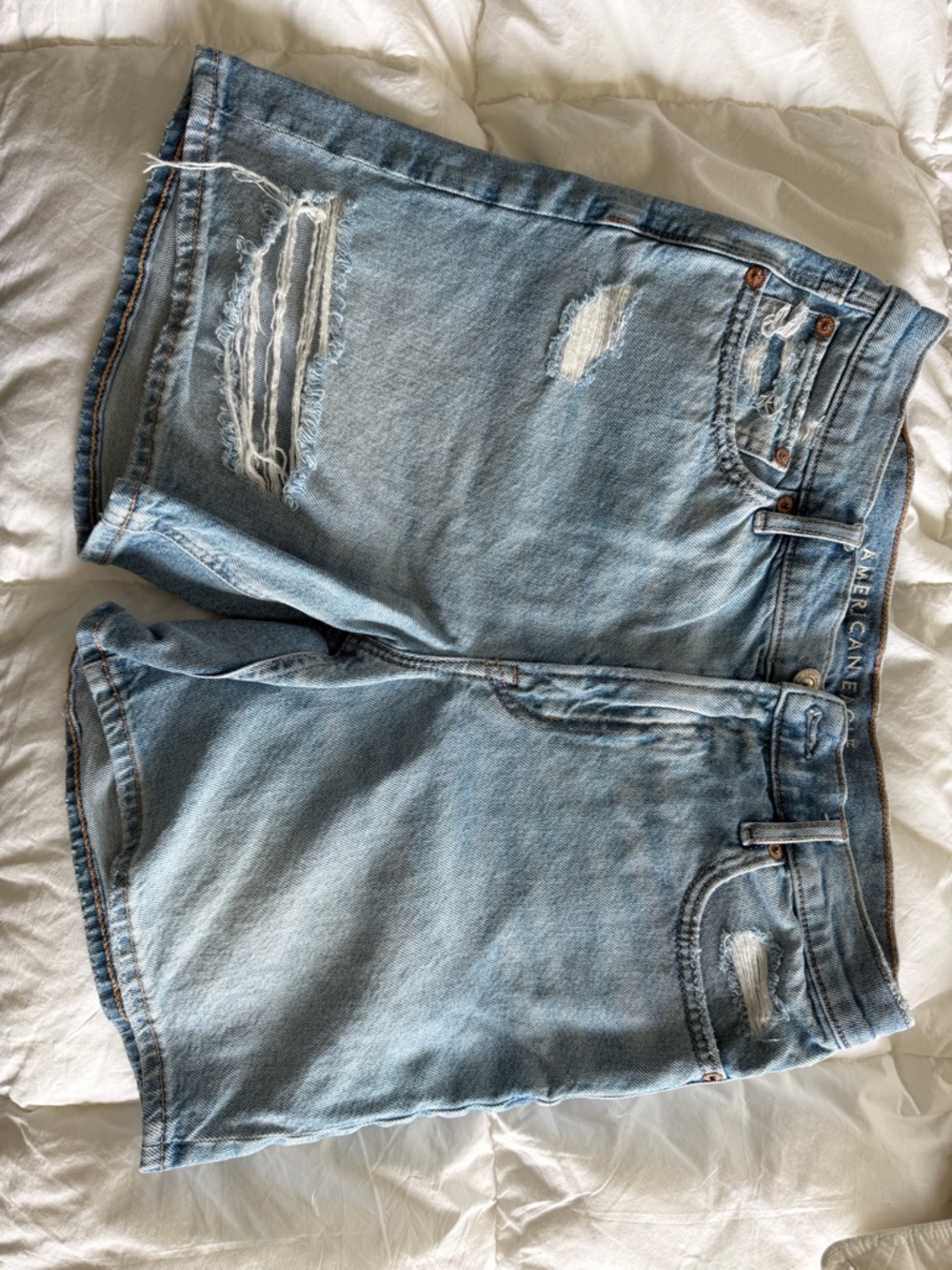 American Eagle Outfitters light blue distressed denim shorts